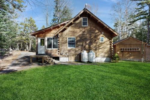 Beaver Cove House | Cozy cabin with covered porch, firepit, grill, fireplace, & washer/dryer