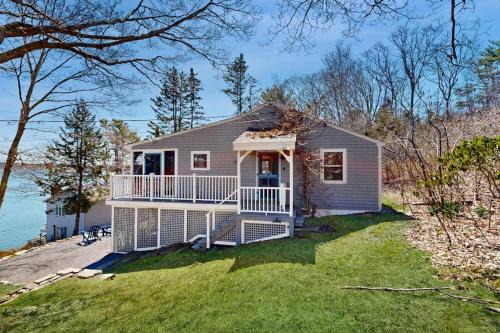 East Boothbay House | Dog-friendly river-view home with wood stove, deck, patio, dock, beach, grill