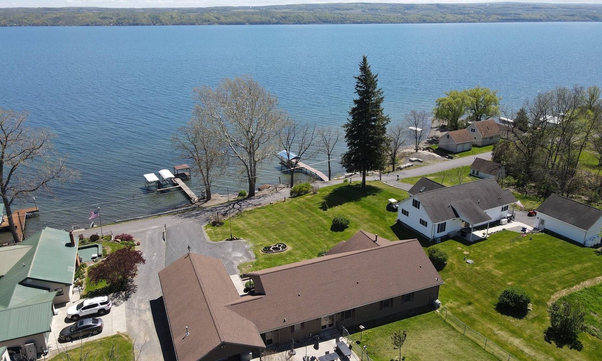 Town of Milo House | Lake front 7-bedroom house with movie theatre, hot tub, and game room!