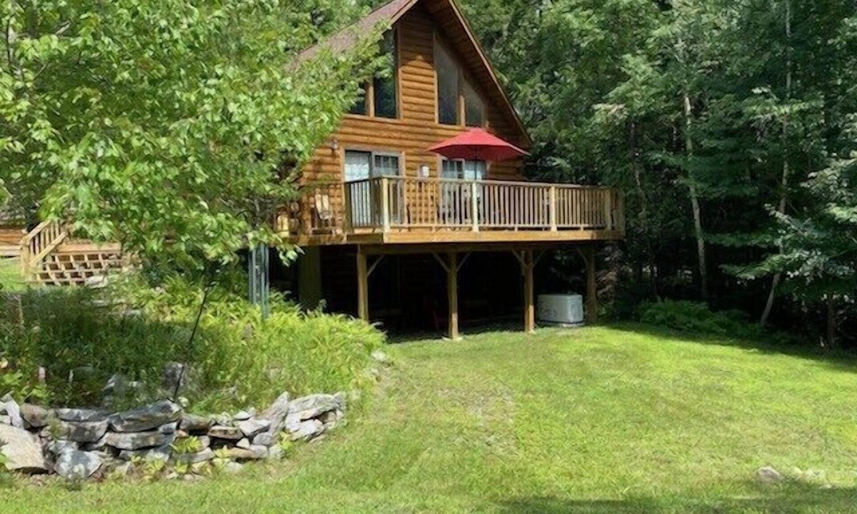 Kents Hill House | Light-Filled Log Home, 4 Wooded Acres, & Lake Access. The water is 0.4 mi away.
