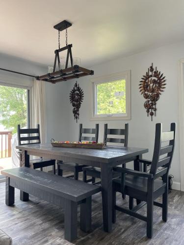 Colebrook House | Modern, Sunset Waterfront Cottage with EV Charger