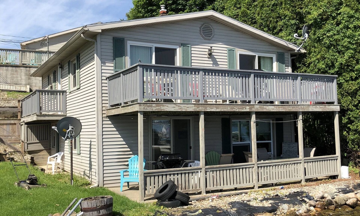 Manitou Beach-Devils Lake Cottage | Two Bed Rooms with a sunrise lakefront view