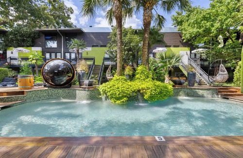Old East Dallas Condo | 2BR/1.5BA furnished condo in Central Dallas with private patio and garden views. King + queen beds, modern kitchen, fast Wi-Fi, washer/dryer, gated parking. Resort courtyard with pool, sauna, cold plunge. Near Downtown.