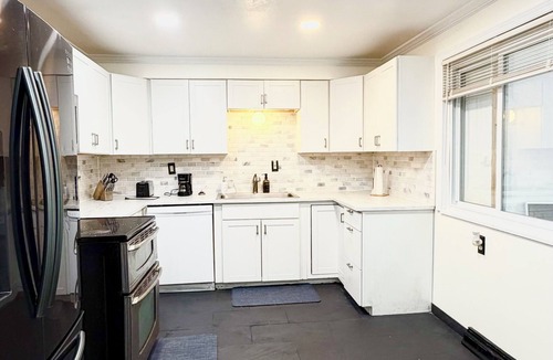 Penn Hills House | 3-bedroom house in vibrant Pittsburgh w/Bar, Sunroom, Deck, and Parking