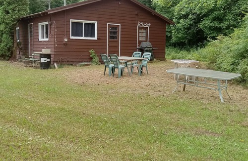 Guys Mills Cabin | A private camp situated on 60 acres. Purple paint for hikers to see huge rocks.