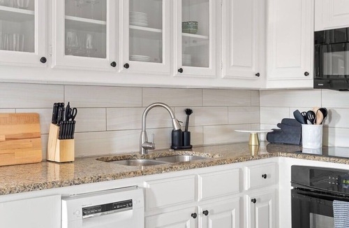 Kessler Apartment | Artsy urban retreat steps from Bishop Arts. Thoughtfully designed with creative touches, a dreamy coffee station, and a king bed you won't want to leave. Gated parking and a responsive host. Repeat guests say it's even more beautiful in person.