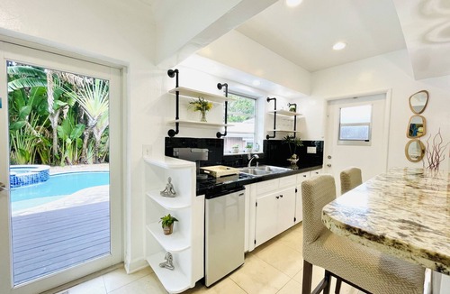 Dolphin Isles House | Bamboo House, Heated pool, Steps from the beach.