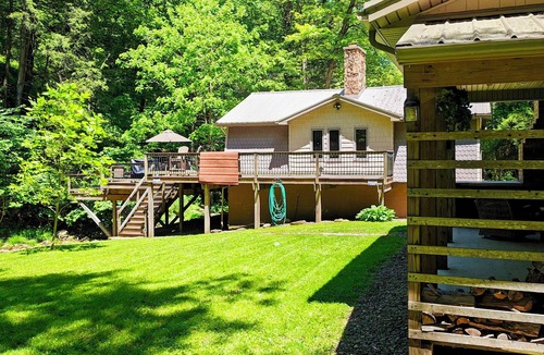Dayton Cabin | Beautiful 2 BR cabin with a wall of windows overlooking the deck and stream.