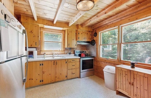 Beaver Cove Cabin | Beautiful home with WiFi, lake view, deck, & firepit - walk to beach