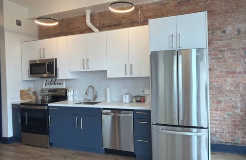 Central Business District Apartment | Bright Sunlit Studio in Downtown Rochester Floor-to-Ceiling Windows