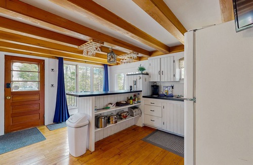Greenville Junction Cabin | Charming Maine cabin with wood stove, firepit, high-speed WiFi, grill, and deck