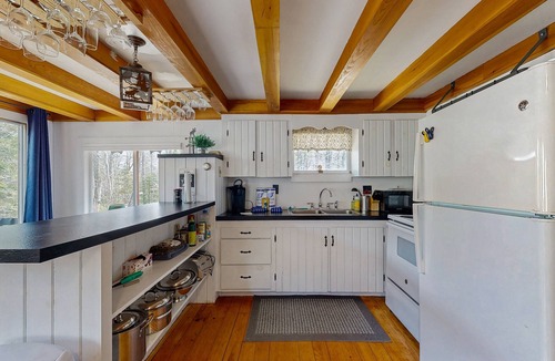 Greenville Junction Cabin | Charming Maine cabin with wood stove, firepit, high-speed WiFi, grill, and deck