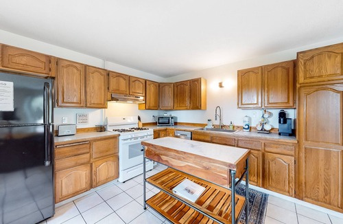 Branchport House | Charming retreat with private hot tub, fireplace, & furnished patio