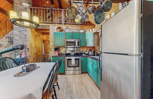 Wiscasset House | Charming riverfront home with cozy interiors, dock, and scenic deck views
