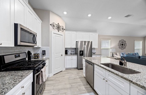 Conroe House | Conroe Single-Story 3BR Sleeps 12 | Fenced Yard, Garage Games, Workspace.