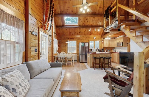 Beaver Cove House | Cozy cabin with covered porch, firepit, grill, fireplace, & washer/dryer