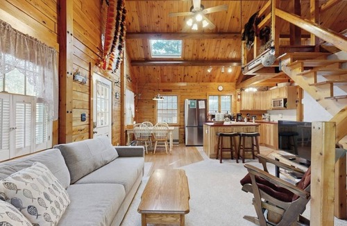 Beaver Cove House | Cozy cabin with covered porch, firepit, grill, fireplace, & washer/dryer