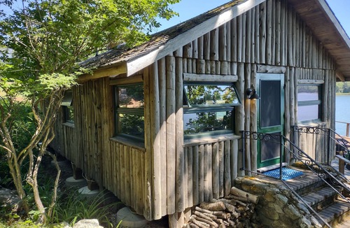 South Bristol Cabin | Cozy waterfront log cottage with huge outdoor living area.