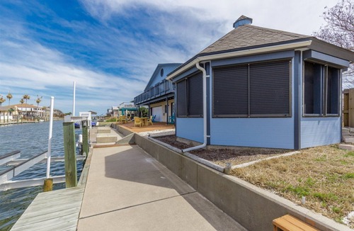 City-by-the Sea House | Crazy about fishing? Check out this home on deep canal near Estes Flats, Redfish Bay, and the Intracoastal Waterway!