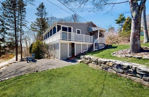 East Boothbay House | Dog-friendly river-view home with wood stove, deck, patio, dock, beach, grill