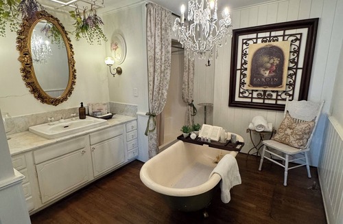 Montgomery Bed & Breakfast | Experience the historic Suite Louise with a parlor and claw tub.