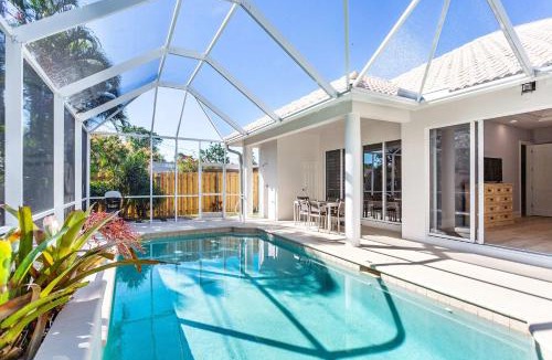 Naples Park House | Imola Vacation Rental - Remodeled Pool Home Minutes from Vanderbilt Beach! Family-Friendly Retreat with 4 BR 4 BA and Private Screened Pool!