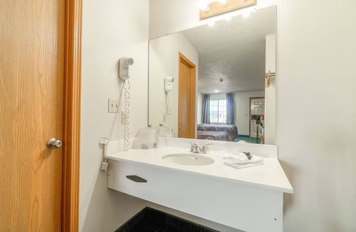 Texhoma Hotel | Inviting Two-Queen Room Conveniently Close to Dining Spots