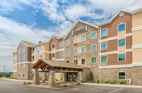 North Canton Condo | King Suite. Free Breakfast Buffet. Pool & Hot Tub Access.