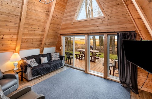 Au Gres Cabin | Lakefront A-Frame with Lofted Interior Ideal for Outdoor Activities in Michigan