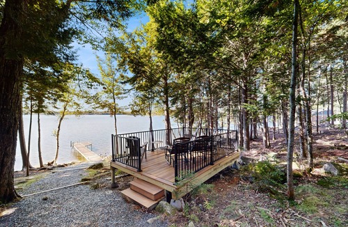 Beaver Cove House | Lakefront cabin close to town with dock, firepit - dogs welcome
