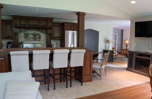 Erie House | Large home with hot tub in serene wooded setting