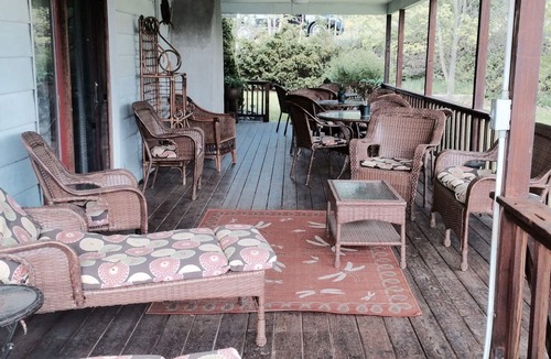 Dundee House | Large Lakefront Reunion And Retreat Home With a large lawn and wrap around porch