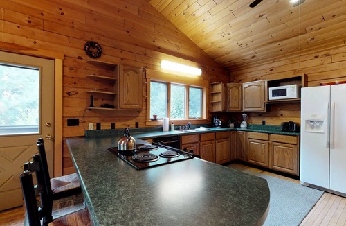 Greenville Junction Cabin | LogHome on Moosehead Lake w/Seasonal Dock, Pebble Beach, Firepit & Spacious Deck