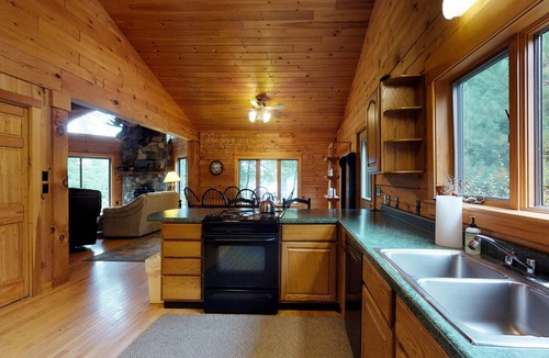 Greenville Junction Cabin | LogHome on Moosehead Lake w/Seasonal Dock, Pebble Beach, Firepit & Spacious Deck