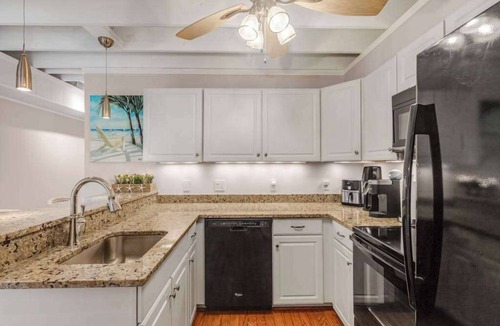 Selbyville House | Mallard Lakes townhouse with hot tub, pool, water views, & fireplace