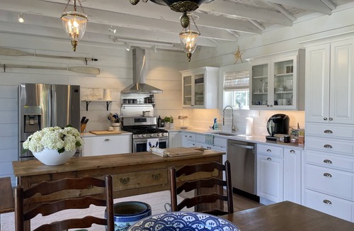 Bayville House | Newly Renovated Carriage House surrounded by water and lush gardens.