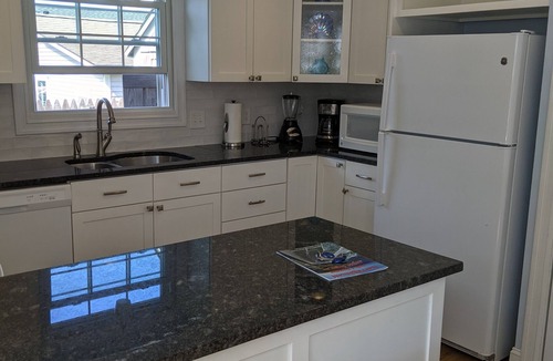 Narragansett Pier Cottage | Ocean view. Feet from the seawall. Price dropped for the final week of summer!