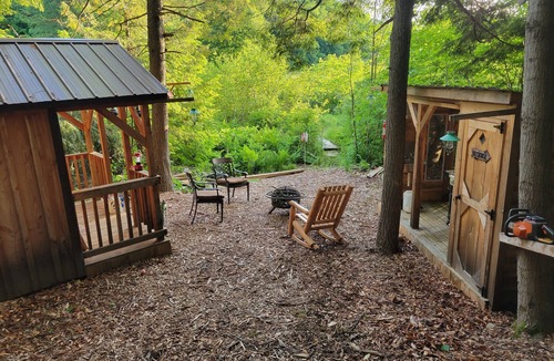Rome Cabin | Off Grid Cabin nestled in the woods next to a stream at the base of Tug Hill
