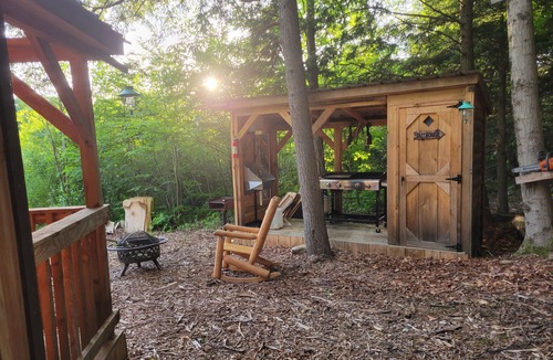 Rome Cabin | Off Grid Cabin nestled in the woods next to a stream at the base of Tug Hill