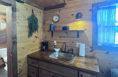 Denison Cabin | Pardon our dust as we work to reopen this charming resort on Lake Texoma!