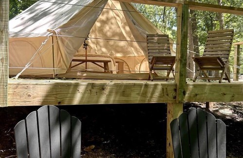 Gentry RV Rental | Peaceful Glamping Tents with Elevated Decks, Cozy Fire Pit, and Secluded Forest Views Near Gentry, AR