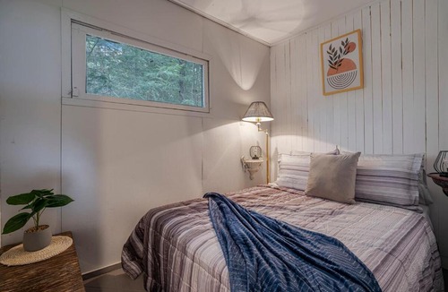 Lake St. Peter House | Rustic Waterfront Cabin with BBQ, Fire Pit and Views