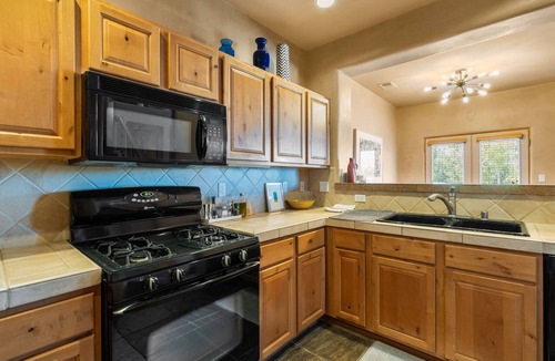 Santa Fe House | Santa Fe 119 | Kiva Fireplace | Office | Vaulted Ceilings