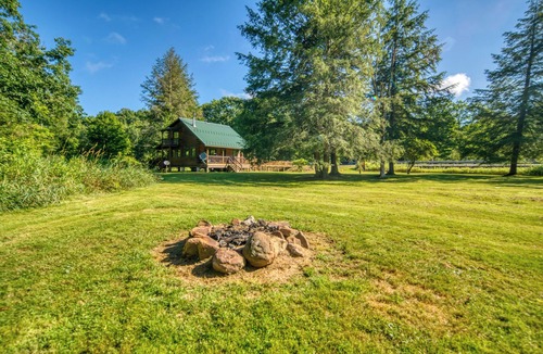 Titusville Cabin | Scenic Log Cabin with Fire Pit & Stocked Creek!