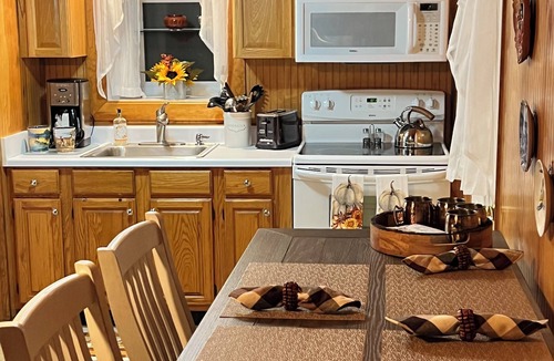Peace Dale Cabin | Small cozy cabin with grill & fire pit close to beaches, skiing, biking and URI.