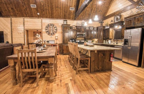 Hochatown Cabin | Soaring cathedral ceilings, gas rock fireplace, large hot tub, smart tv, games.