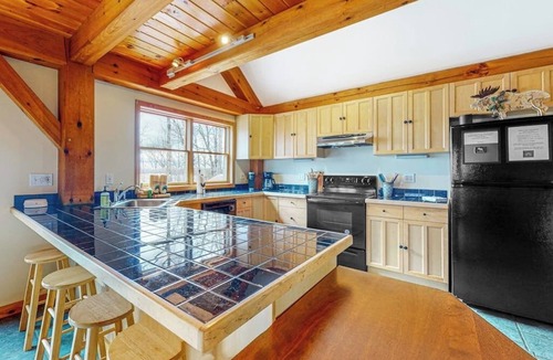 Greenville Junction House | Spectacular lakefront home with dock, firepit, & vaulted ceilings - dog-friendly