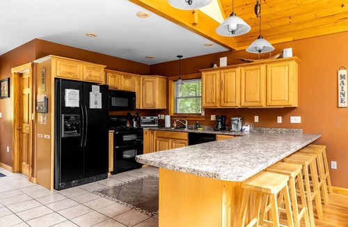 Dover-Foxcroft Cabin | Stunning Cabin Surrounded by Trees and Fire Pit Provided in Bowerbank, Maine