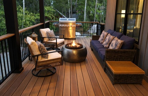 Ellsworth House | Stunning lakefront home with serene outside sitting area overlooking the water.