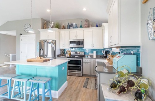 Colington House | Sun Realty pet-friendly centrally-located oceanside home in KDH!
